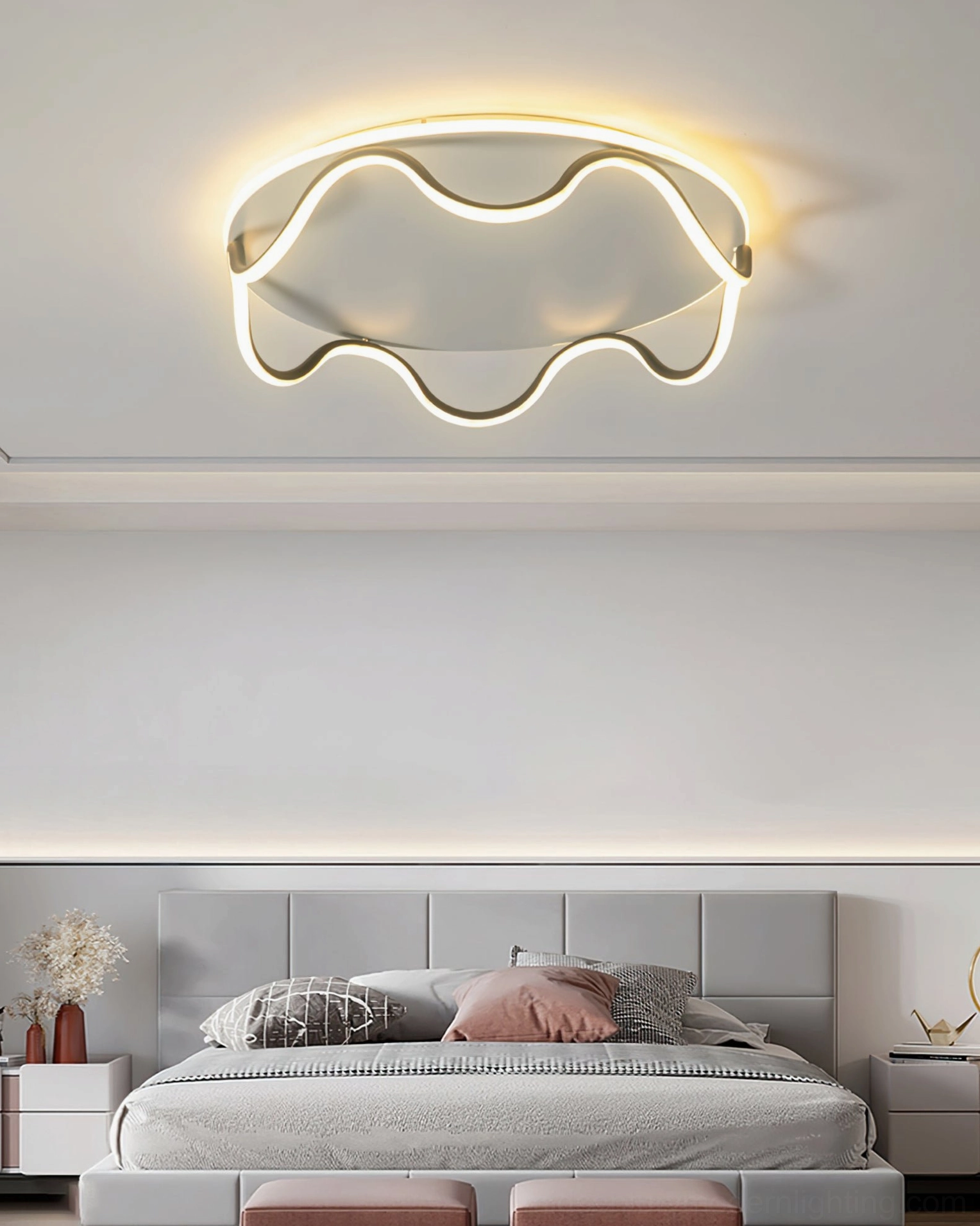 Upward view of white wave ceiling lamp installed in modern master bedroom creating warm ambient glow
