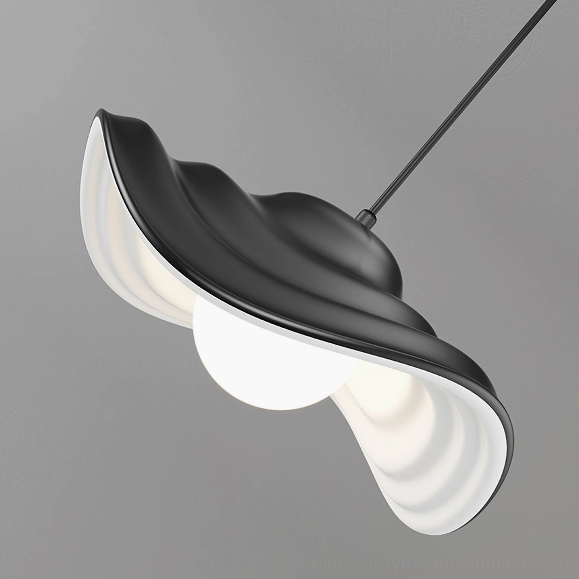 Visilica wavy pendant ceiling lamp installed above dining furniture, demonstrating task and ambient lighting functionality in modern home