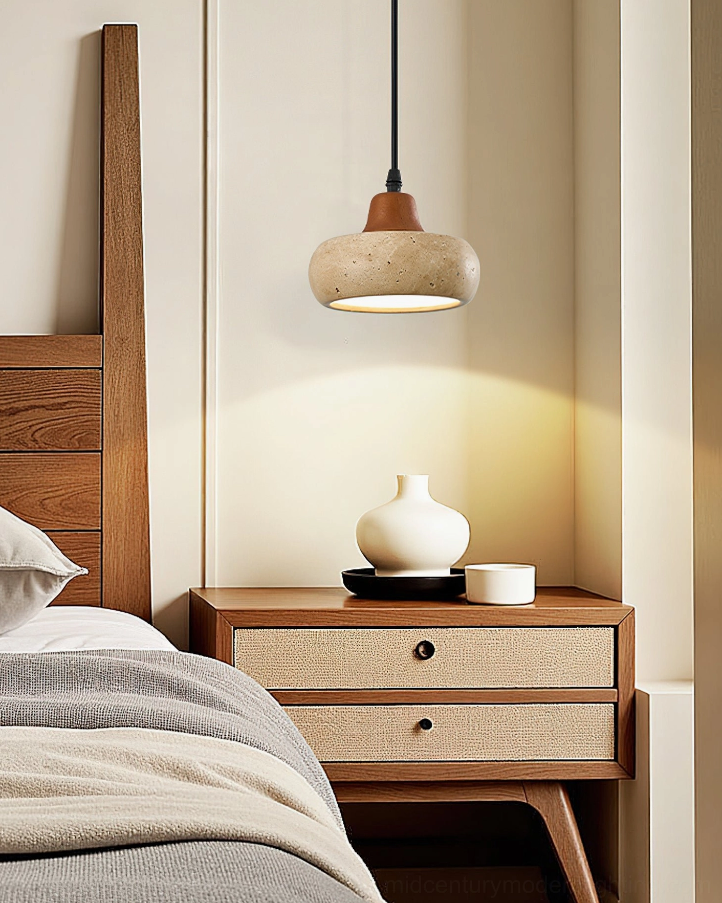 Close-up of Wella travertine pendant light beside wooden nightstand in bedroom bedside area