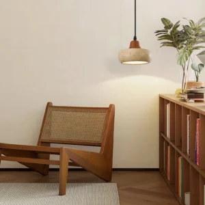Wella pendant light installed in japandi living room corner with wooden chair and minimalist decor