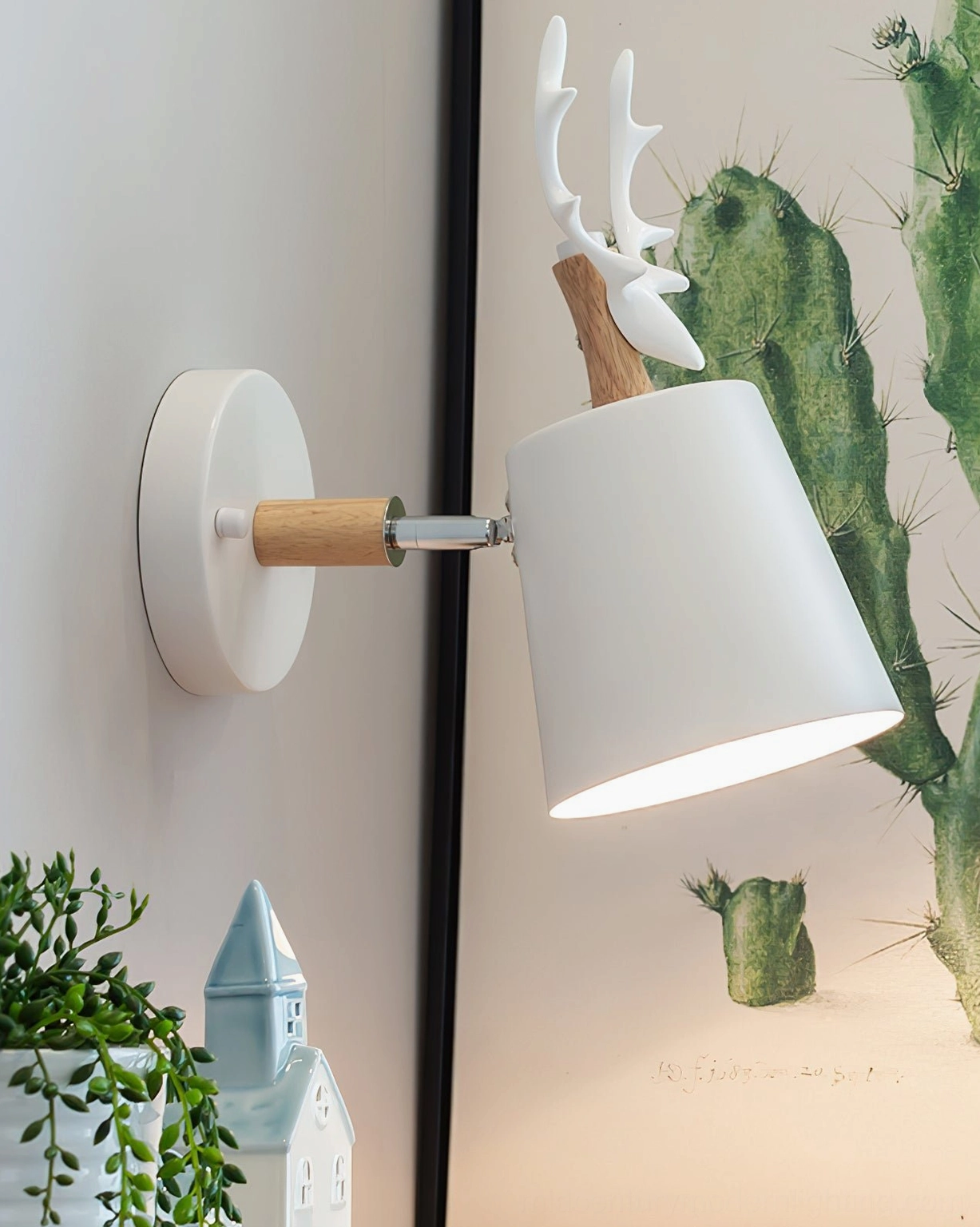 White antler wall lamp side view with natural wood connectors and metal hardware, minimalist Nordic design
