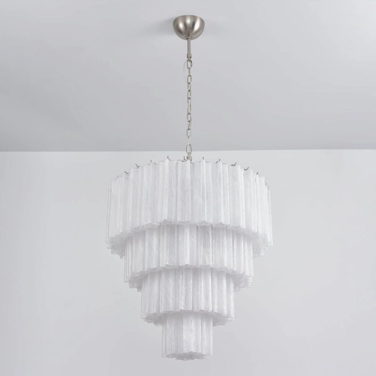 White tiered glass chandelier modern bedroom accent lighting neutral aesthetic sophisticated
