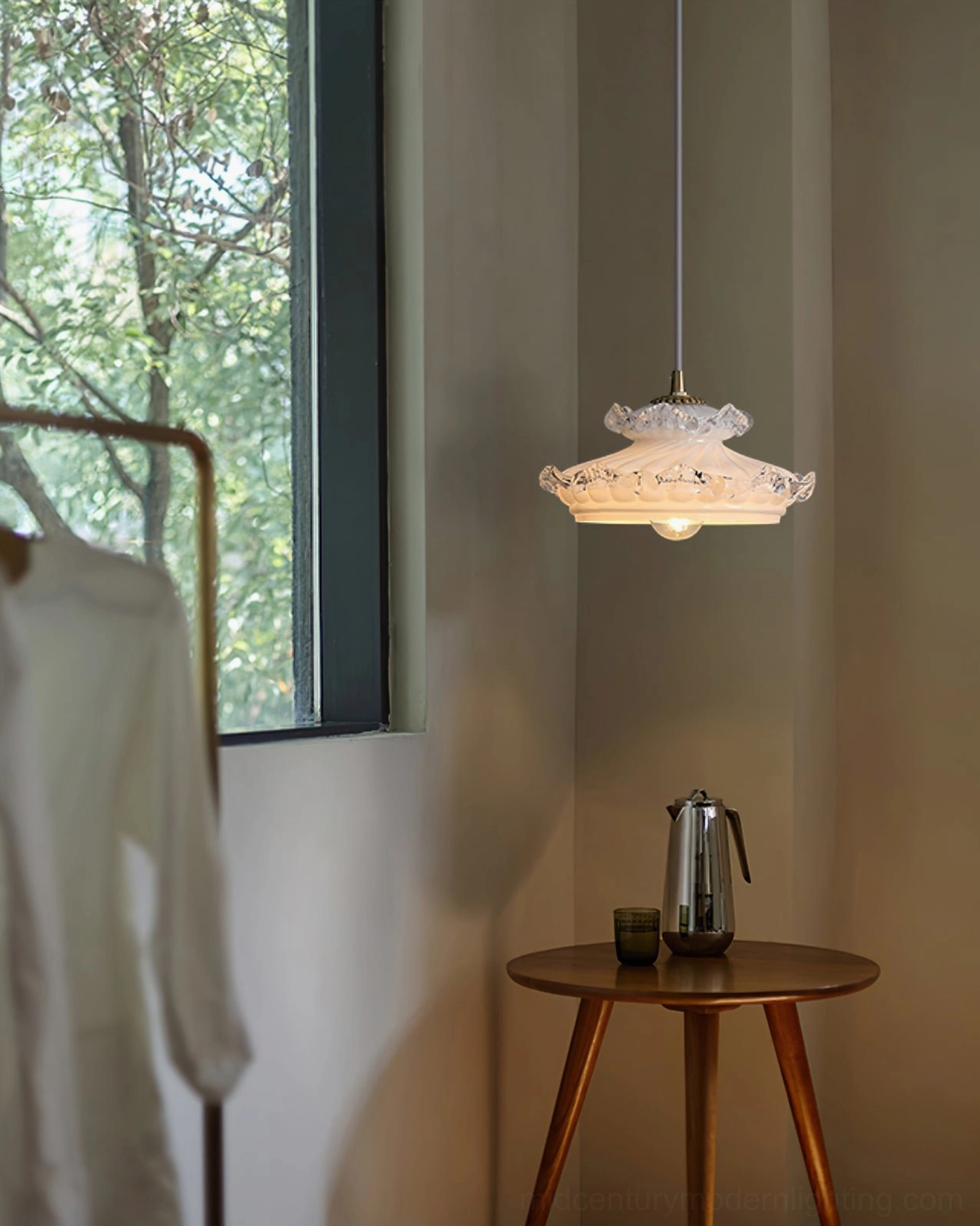 White glass pendant light with textured clear glass rim and brass mounting hardware