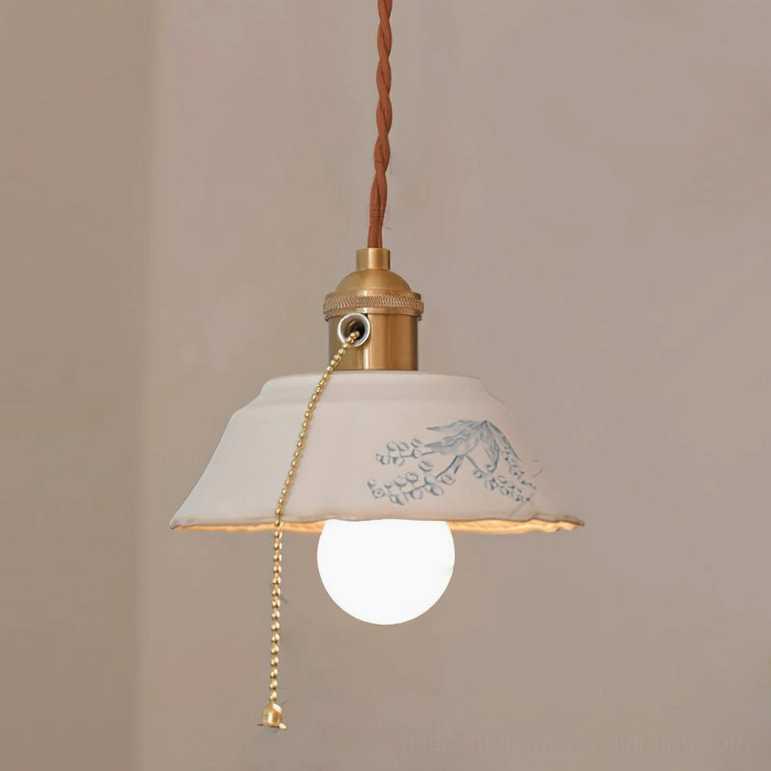 White ceramic vintage pendant light with brass accents suitable for mid-century modern bedroom decor