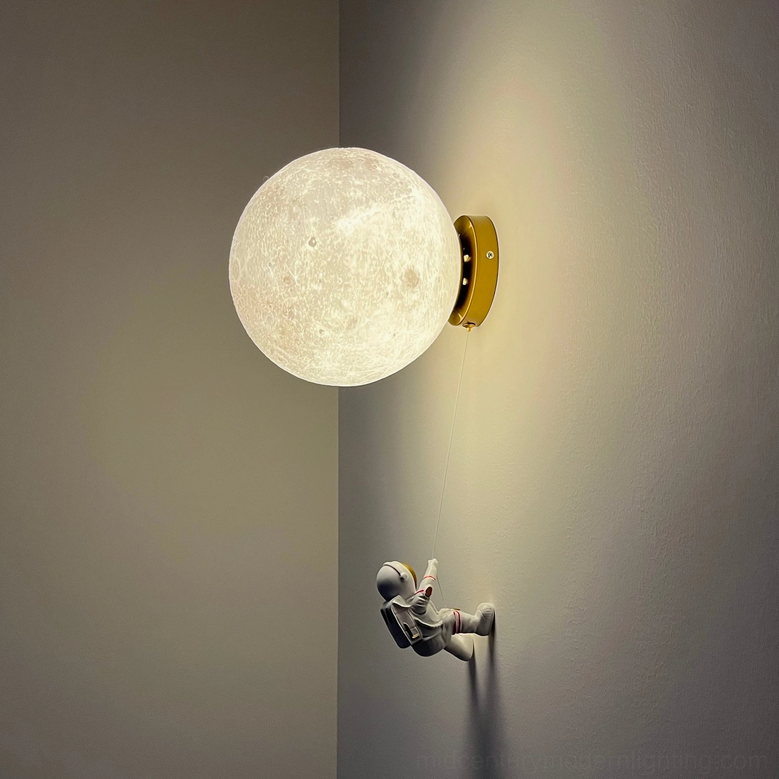 Bright white unlit lunar globe wall lamp on minimalist white wall