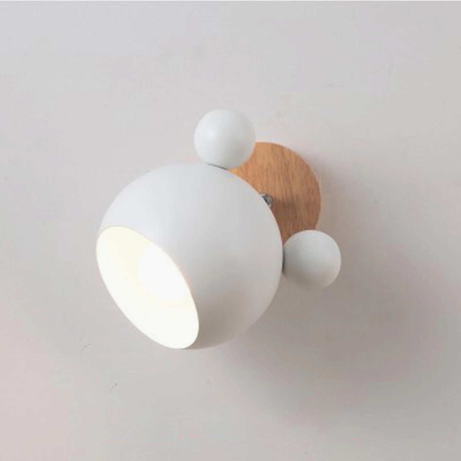 Clean white mouse-shaped wall lamp front view against neutral gray background