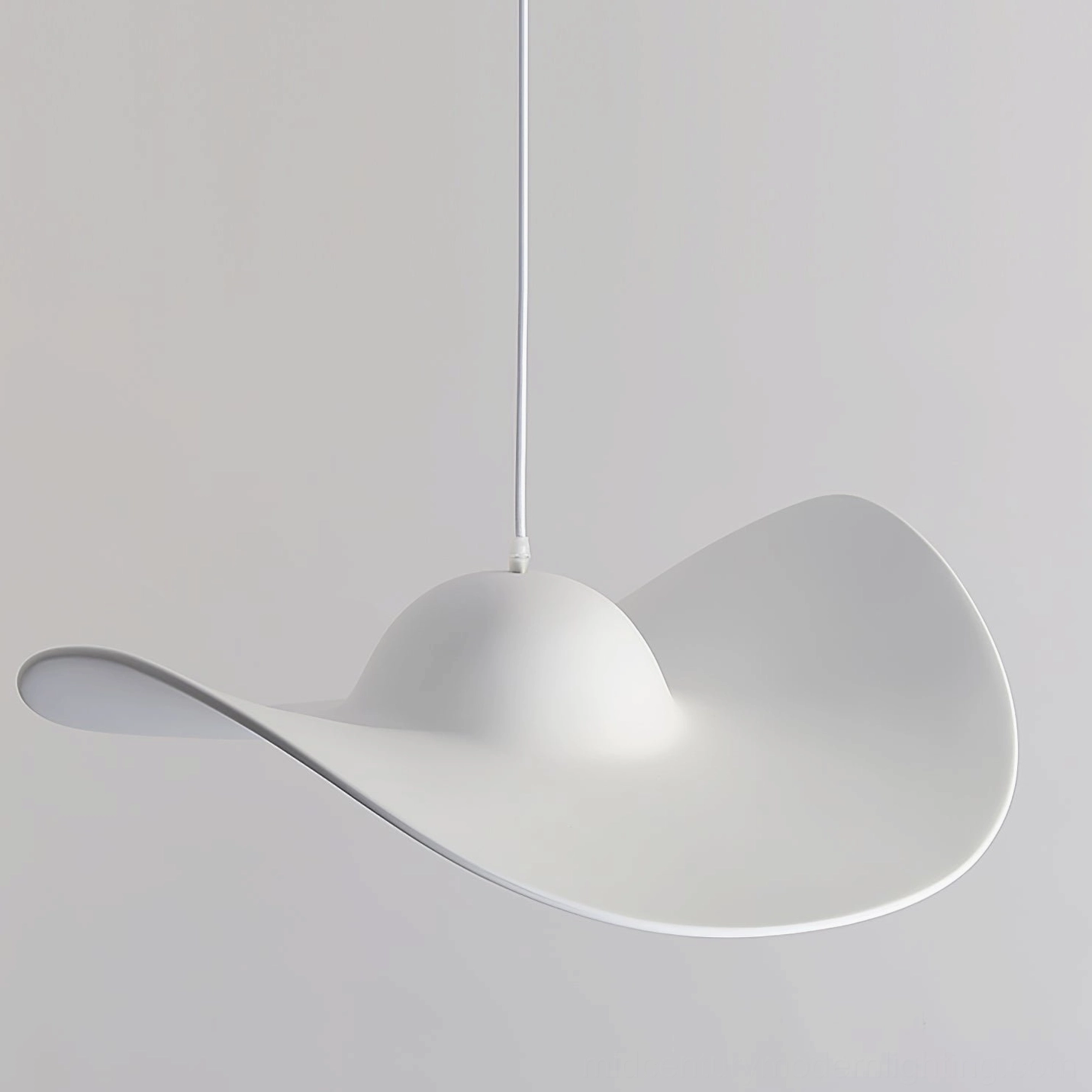 White straw hat-shaped pendant lamp hanging as functional art piece