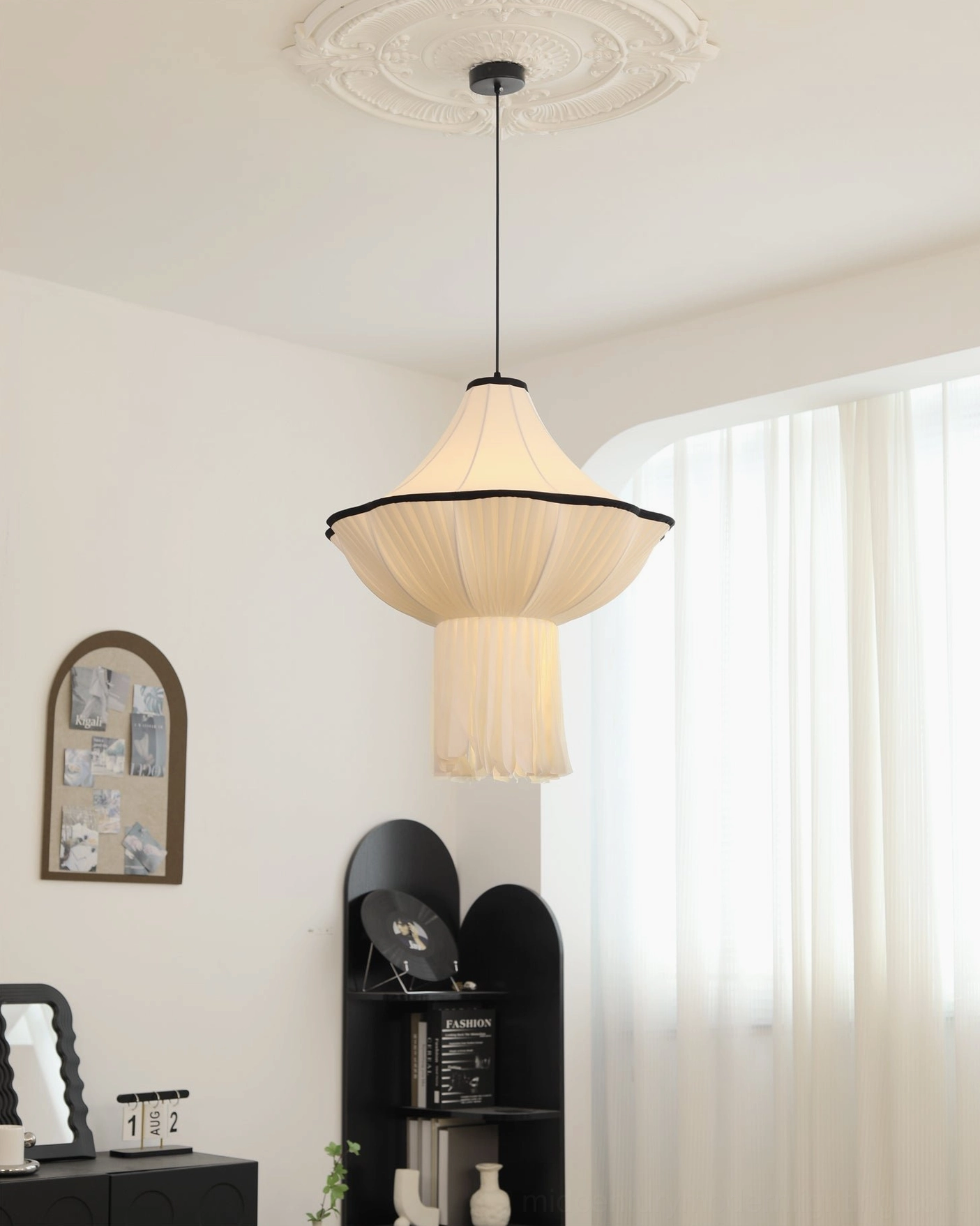 Wildon pendant light with black ceiling mounting hardware and decorative ceiling medallion