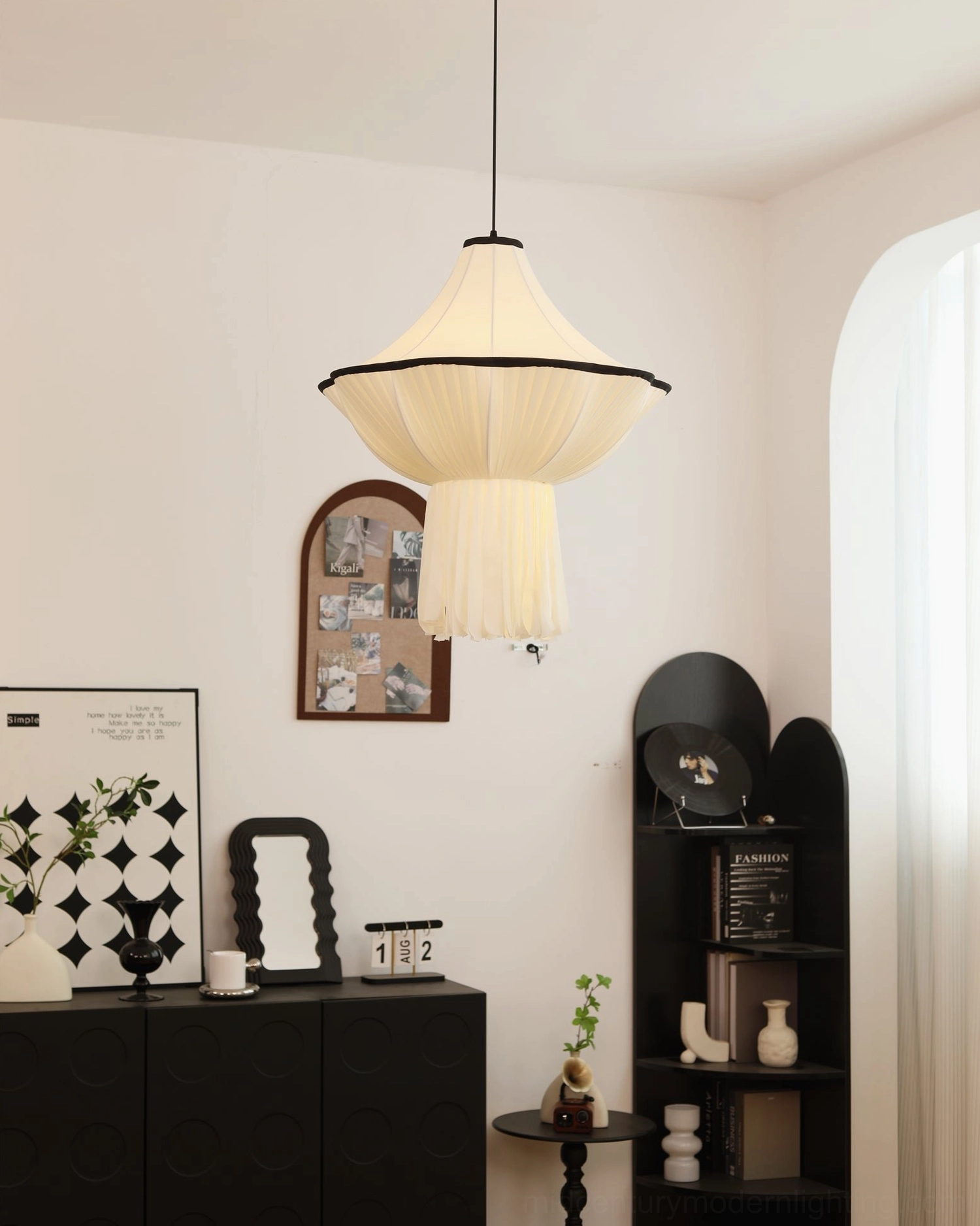 Wildon pendant light installed in vintage living room showing black trim detail and soft diffused illumination