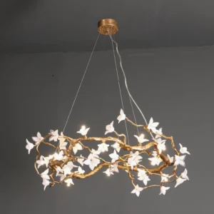 Willow Flower Chandelier installed in interior space with warm LED lighting illuminating glass petals and twisted brass framework