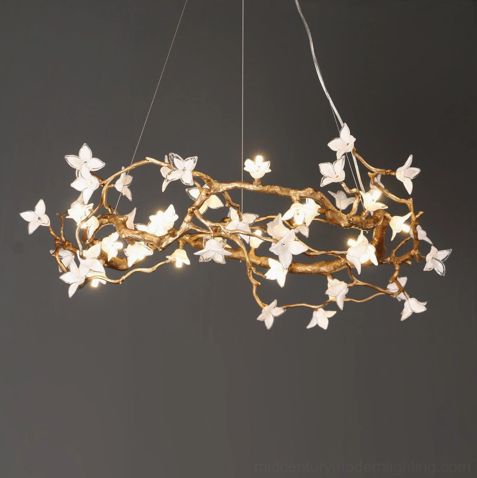 Long oval Willow Flower Chandelier frontal view with densely clustered glass flower accents and warm ambient glow