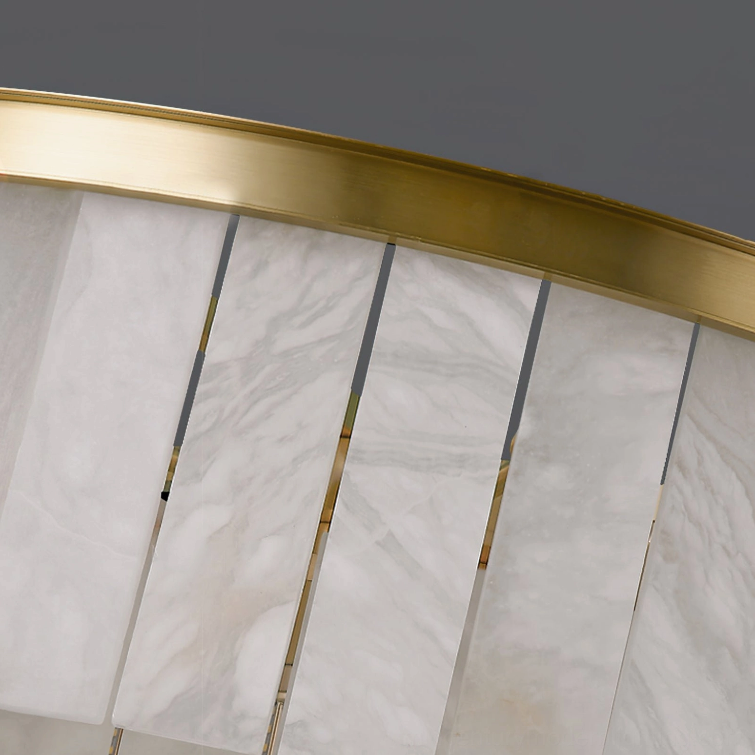 Polished brass hardware and trim with spaced alabaster panels showing construction quality and design precision