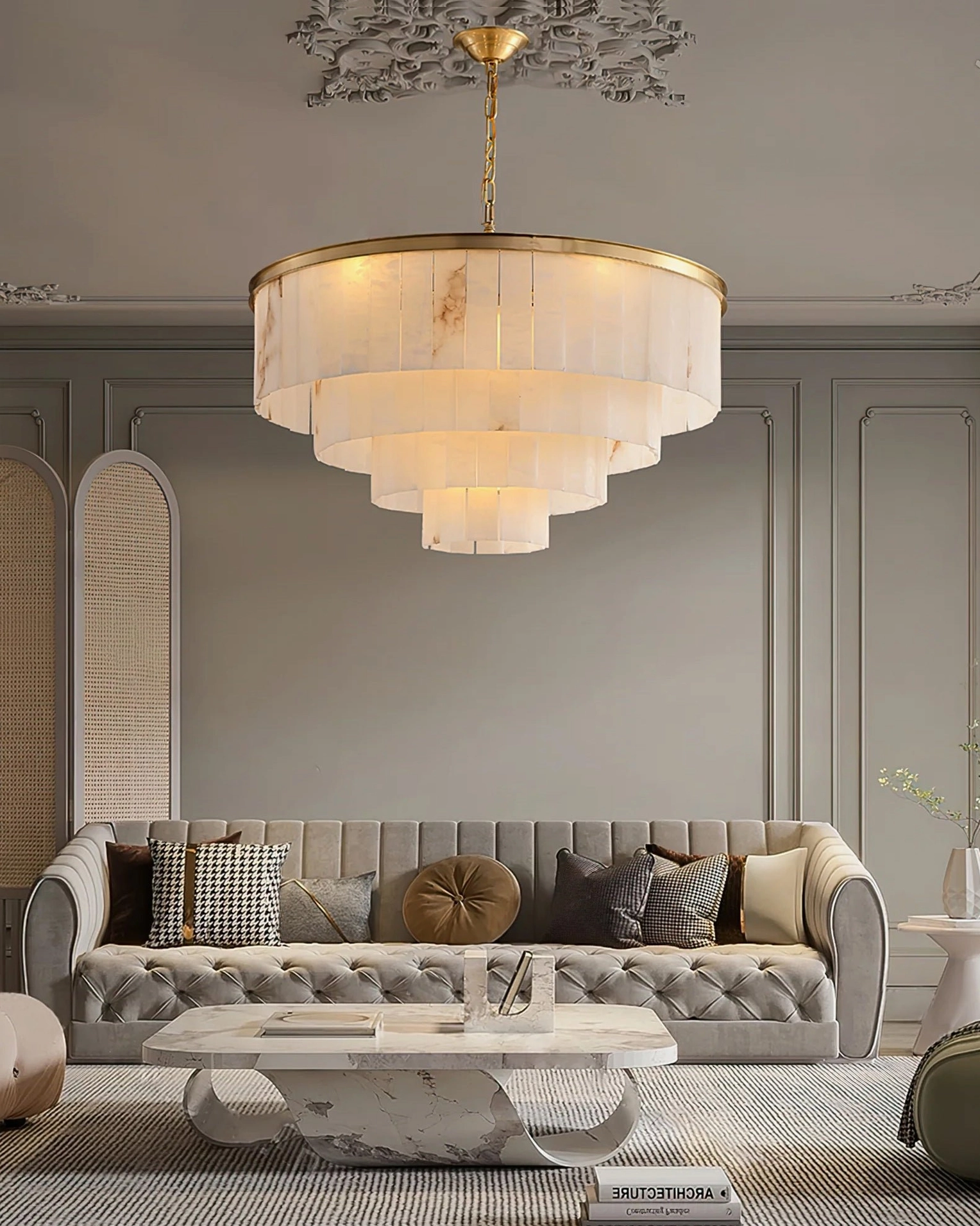 3-tier alabaster brass chandelier installed overhead view in luxury modern living room with tufted sofa