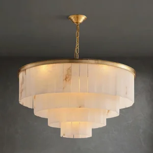 Layered alabaster chandelier close-up showing warm glowing light and natural marble veining detail on stone panels