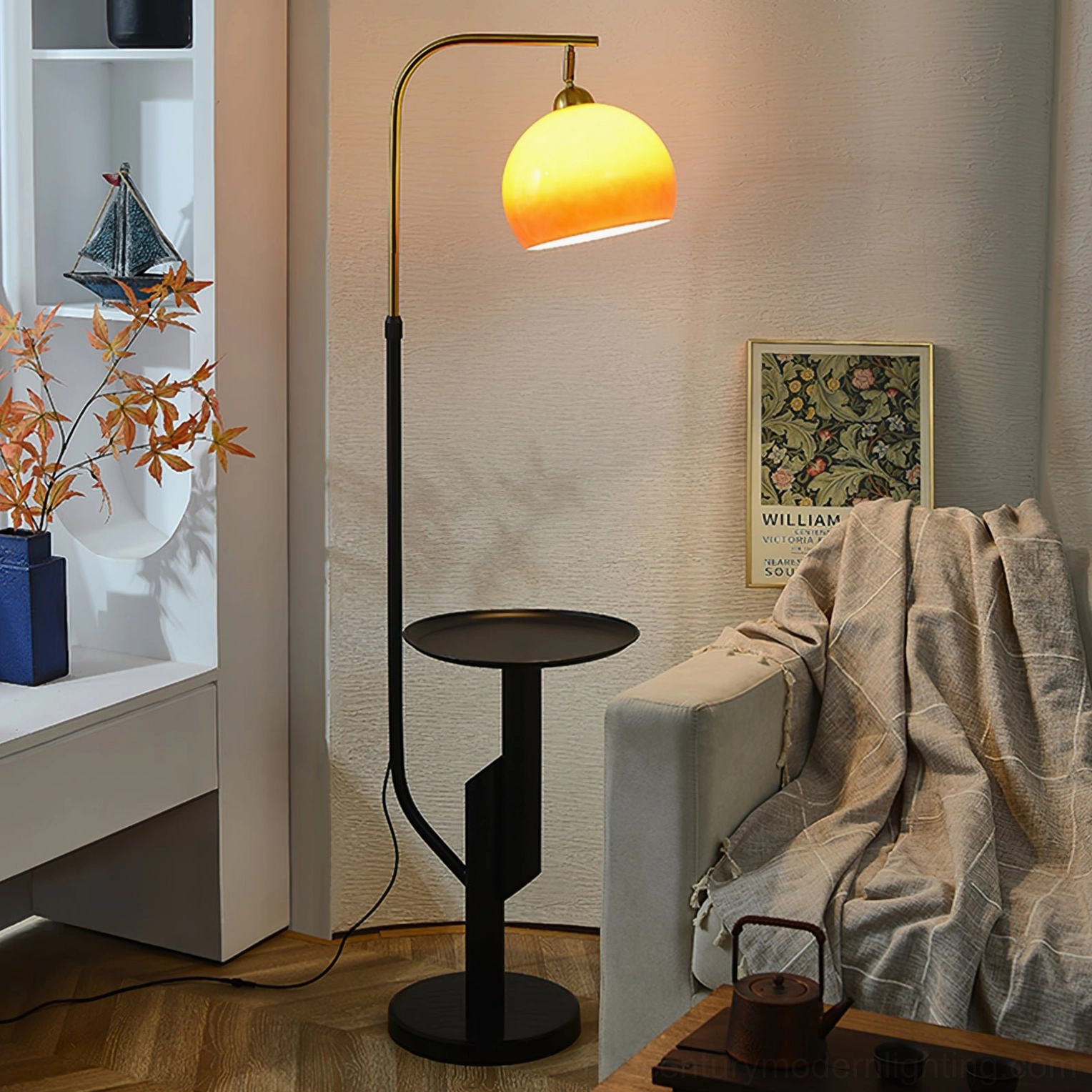 Winona arc floor lamp detail shot showing brass arm structure and integrated round side table