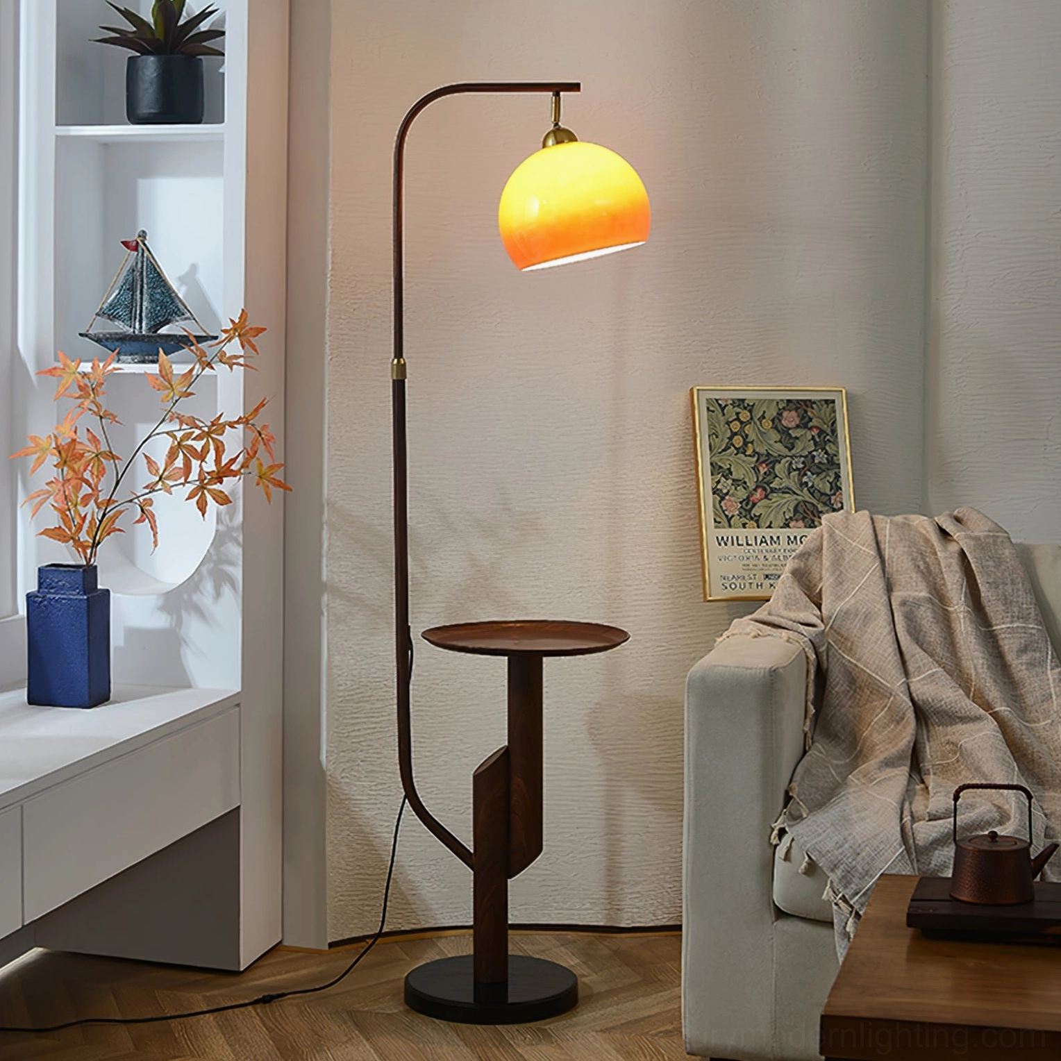 Winona arc floor lamp in cozy modern living room nook with brown wooden stand and draped throw textile