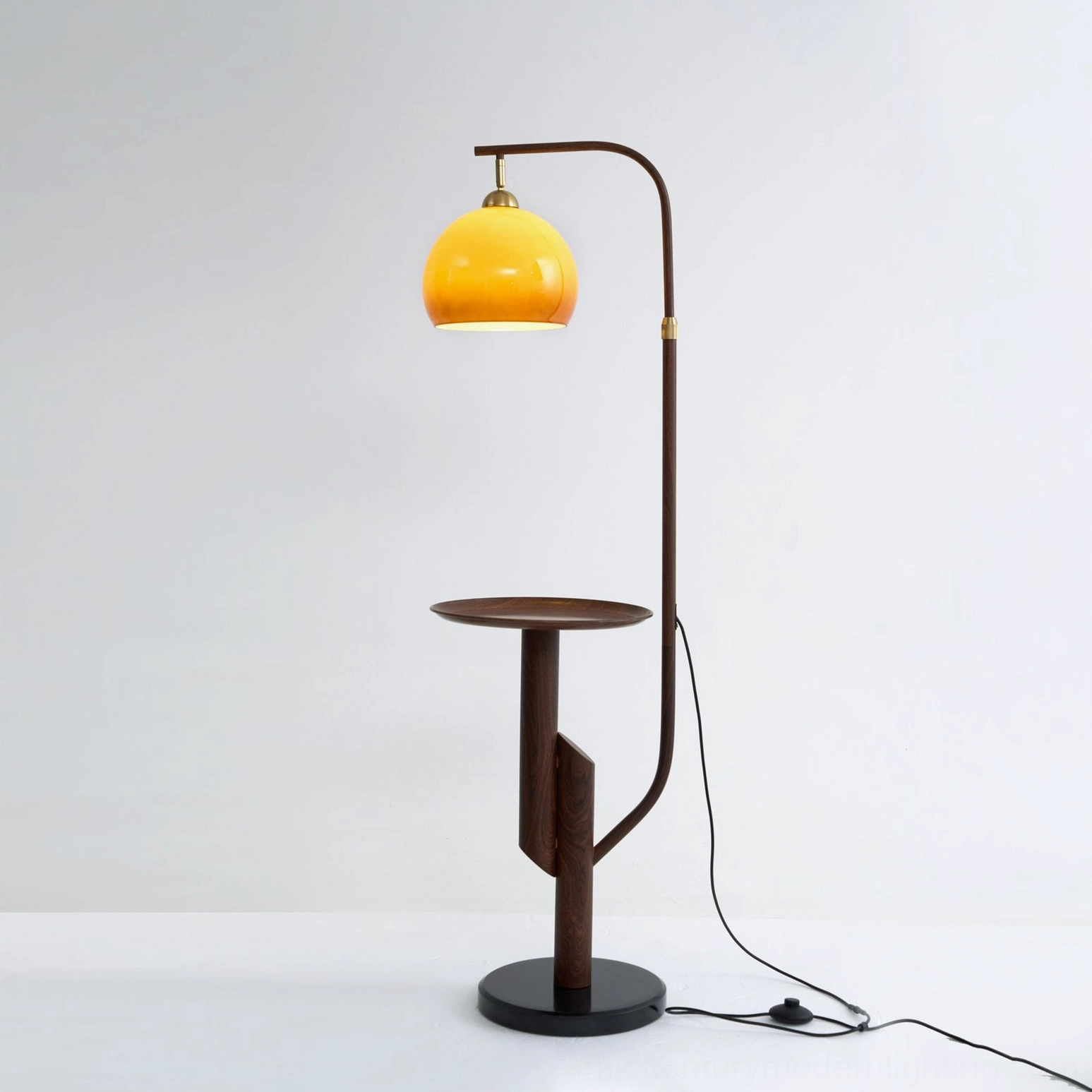 Winona arc floor lamp walnut finish variant, warm brown metal frame with caramel glass shade