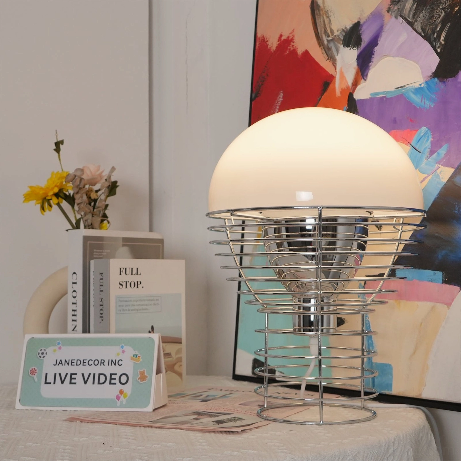 Wire cage table lamp left side profile showing exposed Edison bulb in metal cage structure