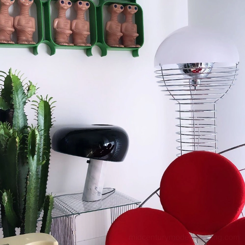 Wire floor lamp positioned in residential interior demonstrating space-conscious design and architectural appeal
