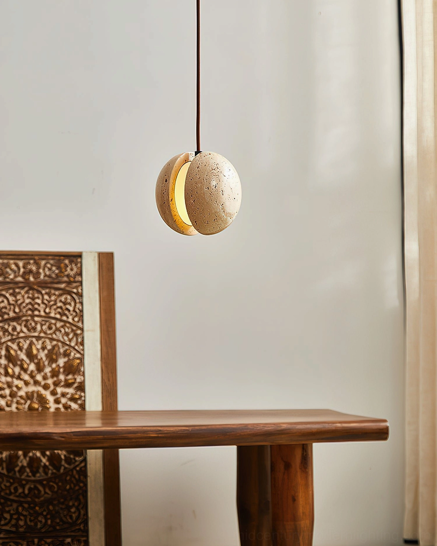 Wisteria pendant lamp illuminated above wooden dining table with carved mid-century chair, warm ambient lighting, interior dining scene