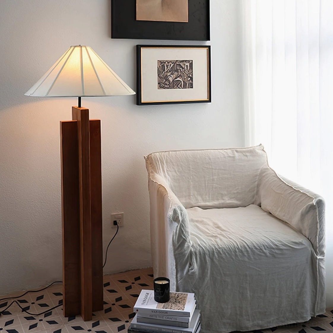Wood floor lamp with geometric base in cozy living room with armchair, daylight interior styling