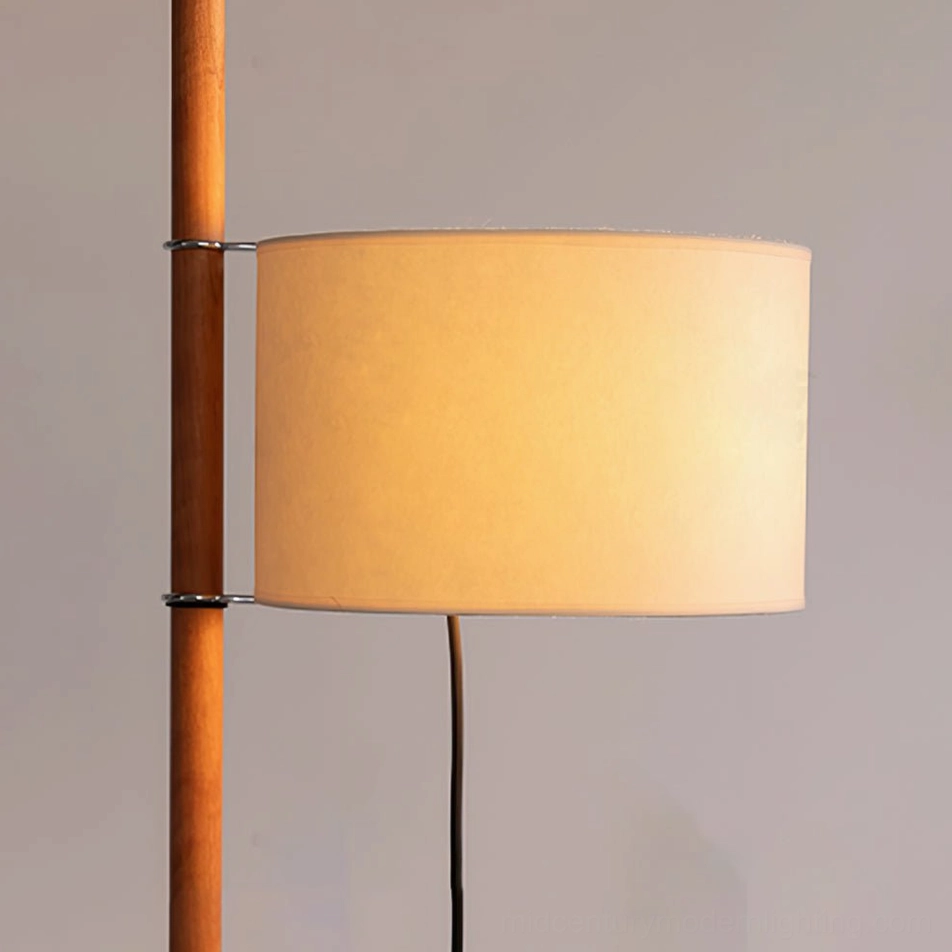 Wooden floor lamp detail shot highlighting fabric shade and wood pole craftsmanship