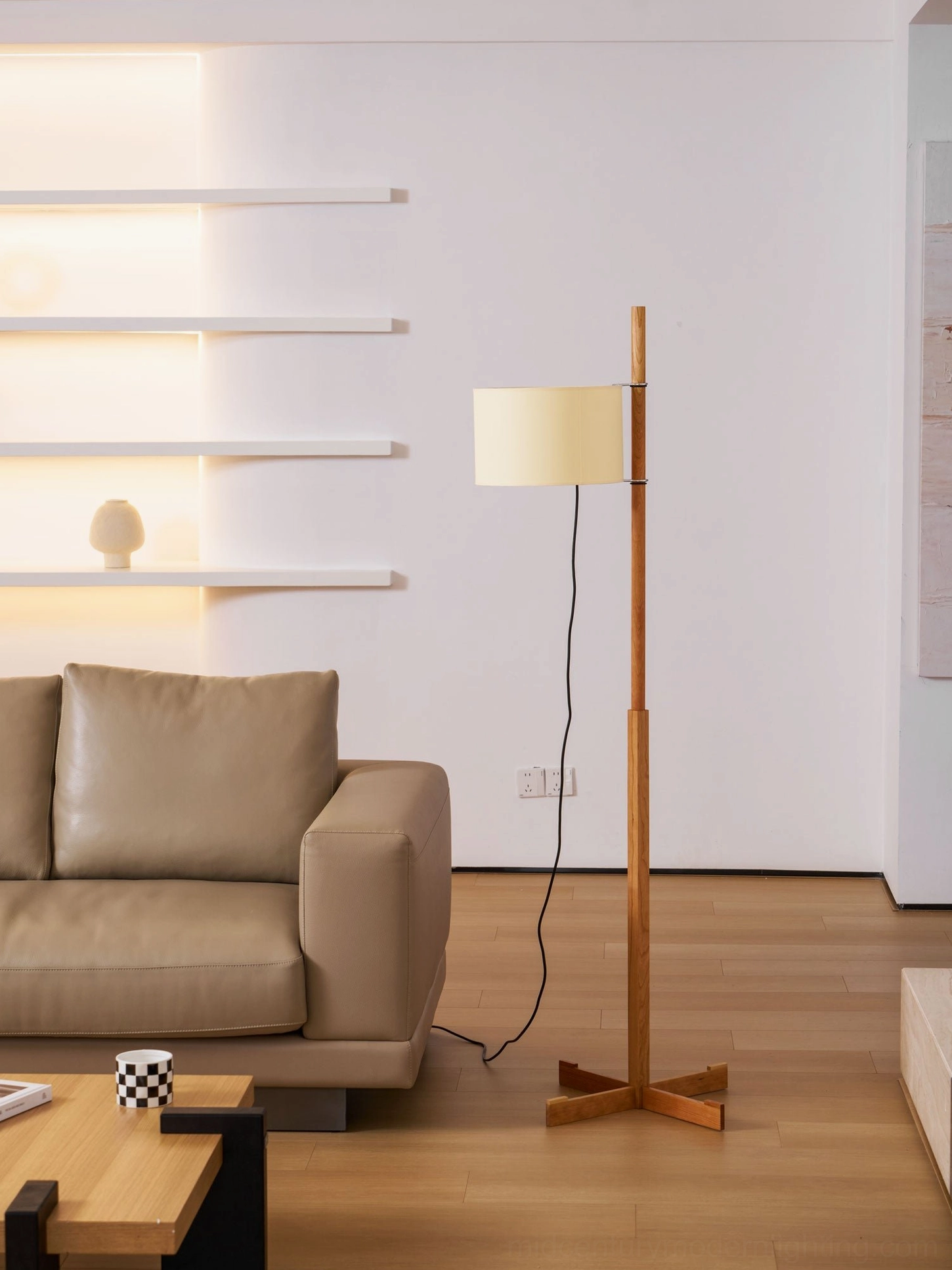 Side profile view of wooden floor lamp showing linear solid wood pole structure