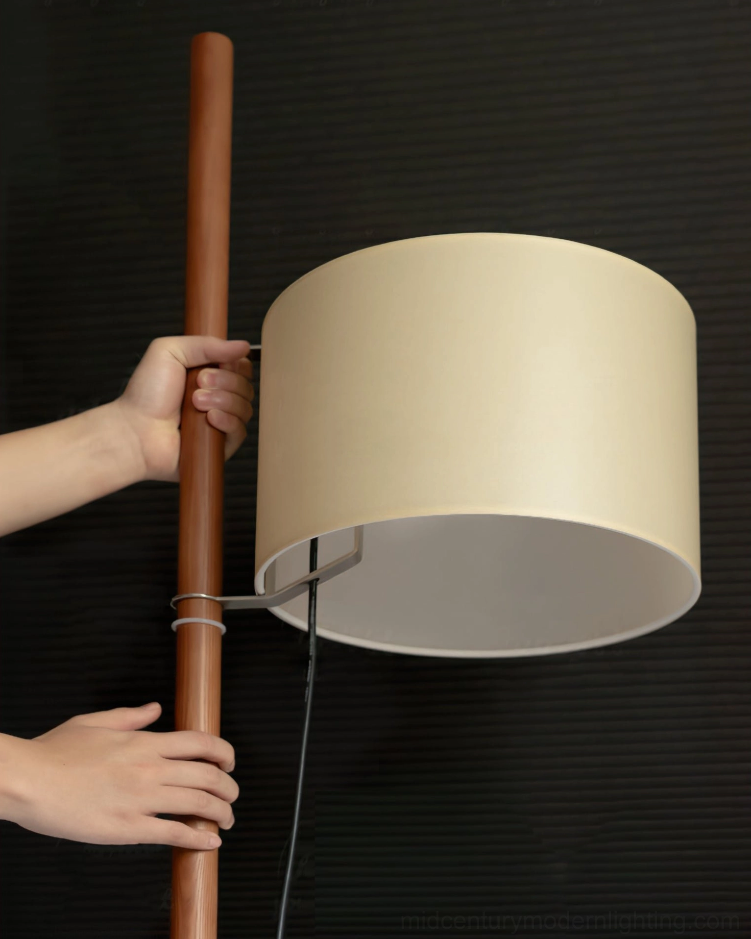 Wooden floor lamp creating warm lighting ambiance in modern residential interior