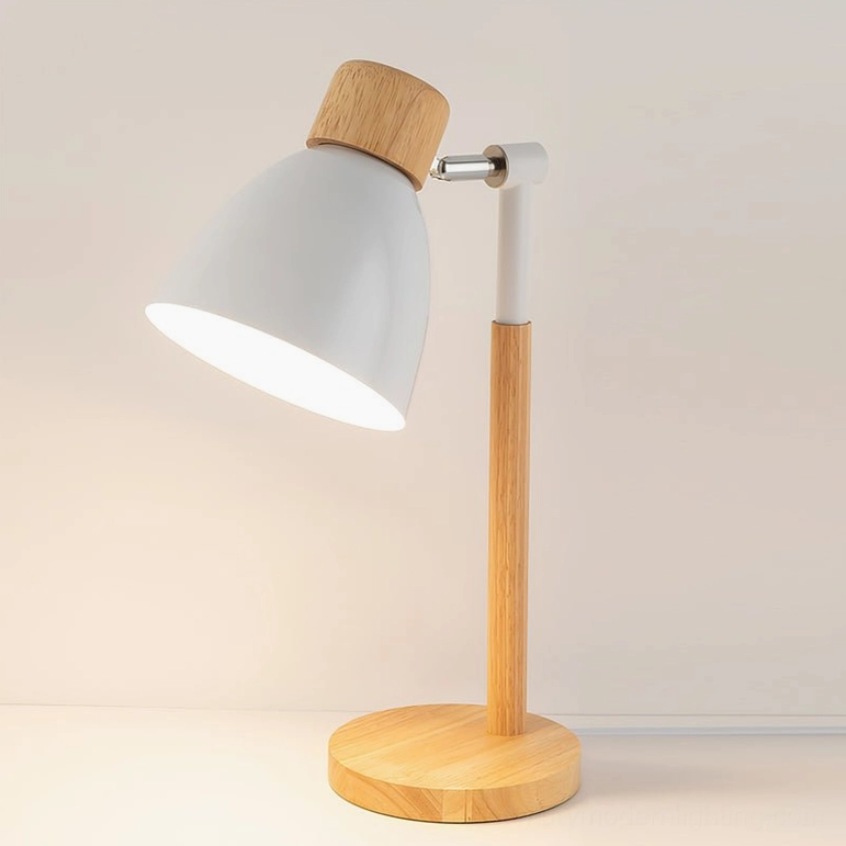 Scandinavian wood table lamp detail view showing articulated metal shade joint and smooth rotating mechanism