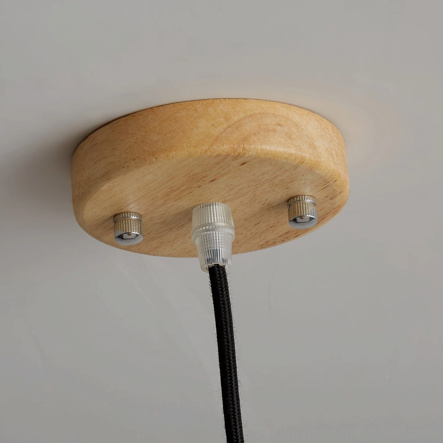 Natural wood pendant light installed in contemporary home interior with minimalist aesthetic styling