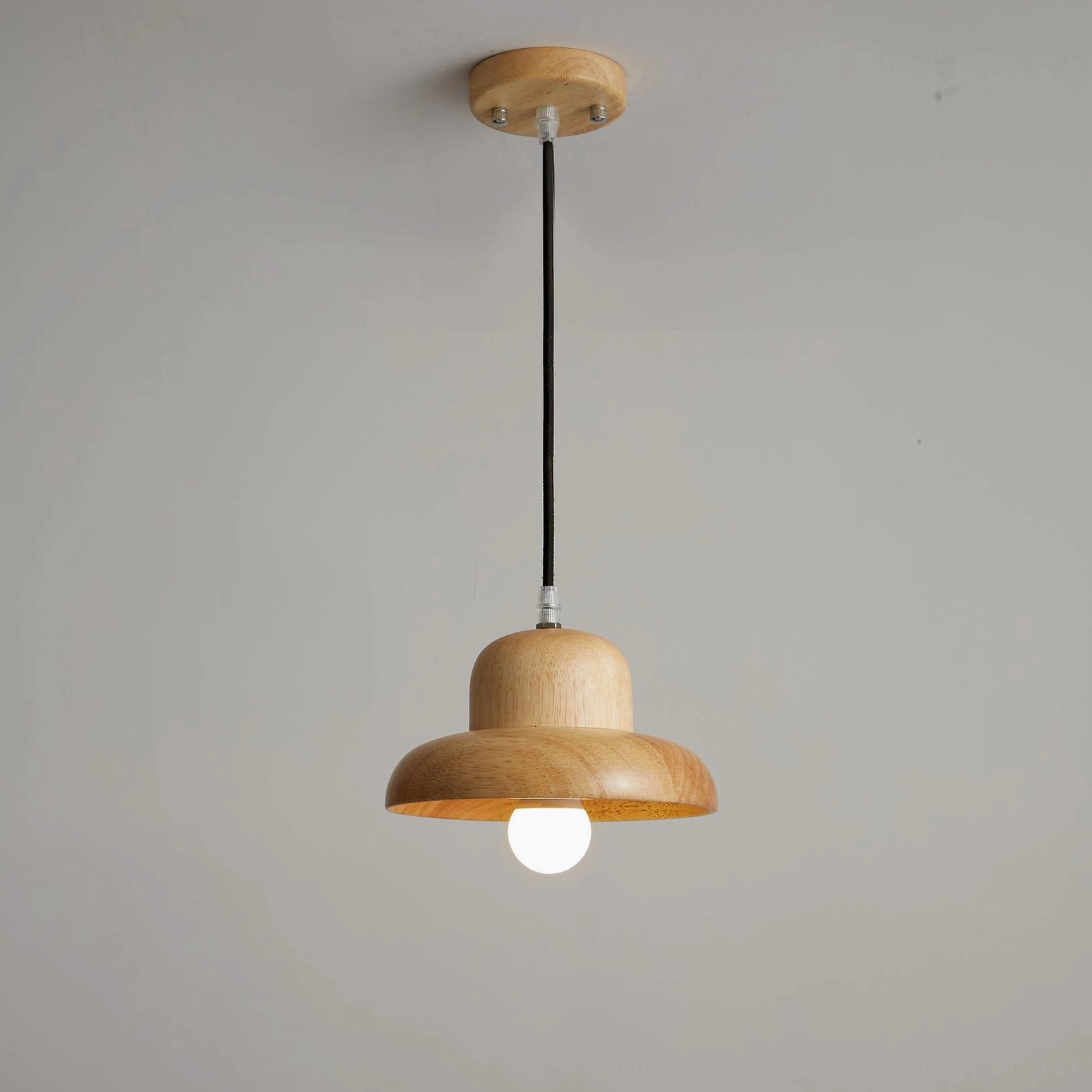 Wooden pendant light with cord suspension system showing design elegance and installation simplicity