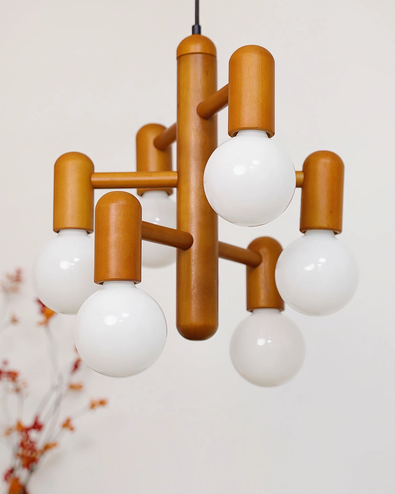 Solid wood frame with matte white opal glass globes, close-up detail shot