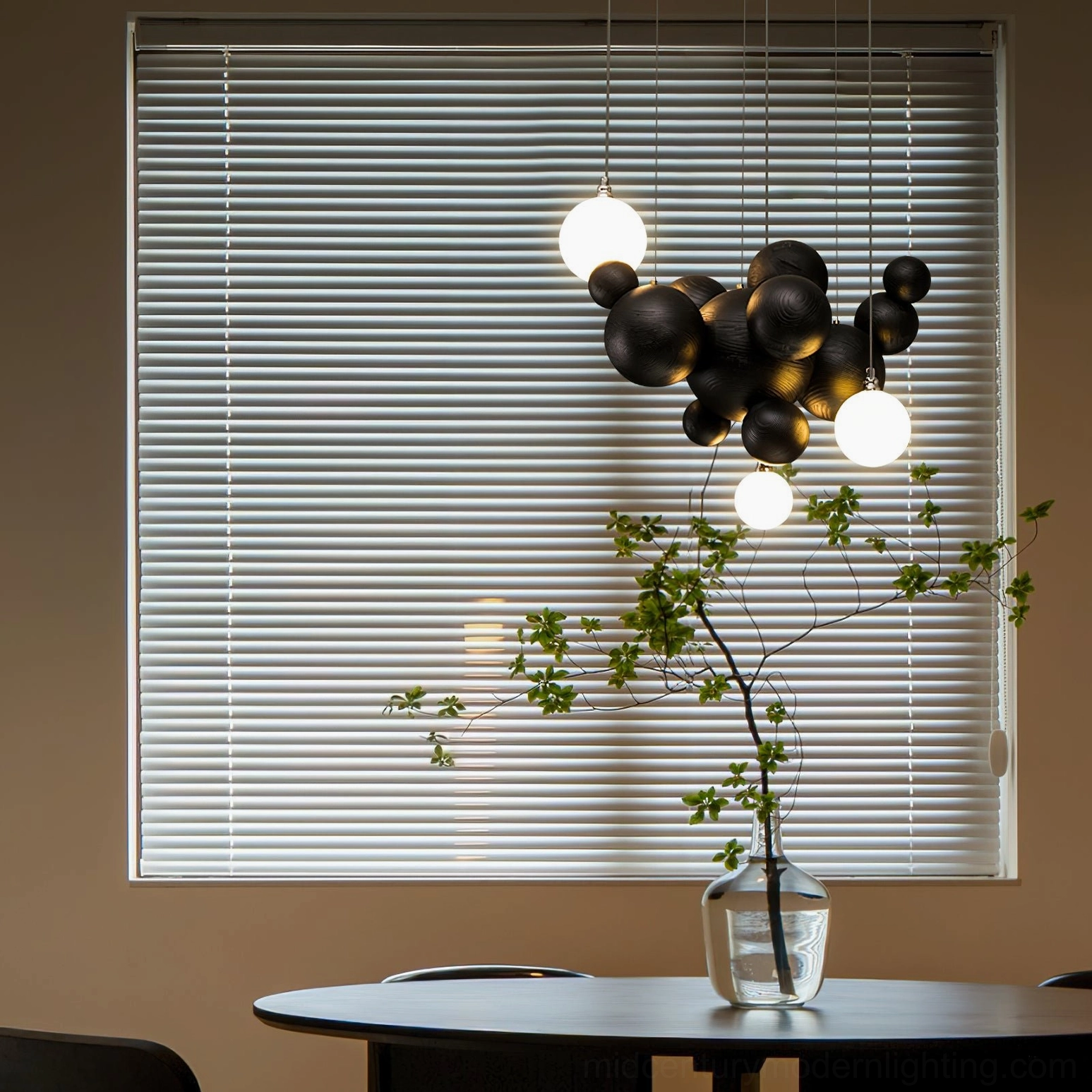 Bubble wood balls chandelier illuminated above dining table, showing warm ambient lighting in contemporary home interior