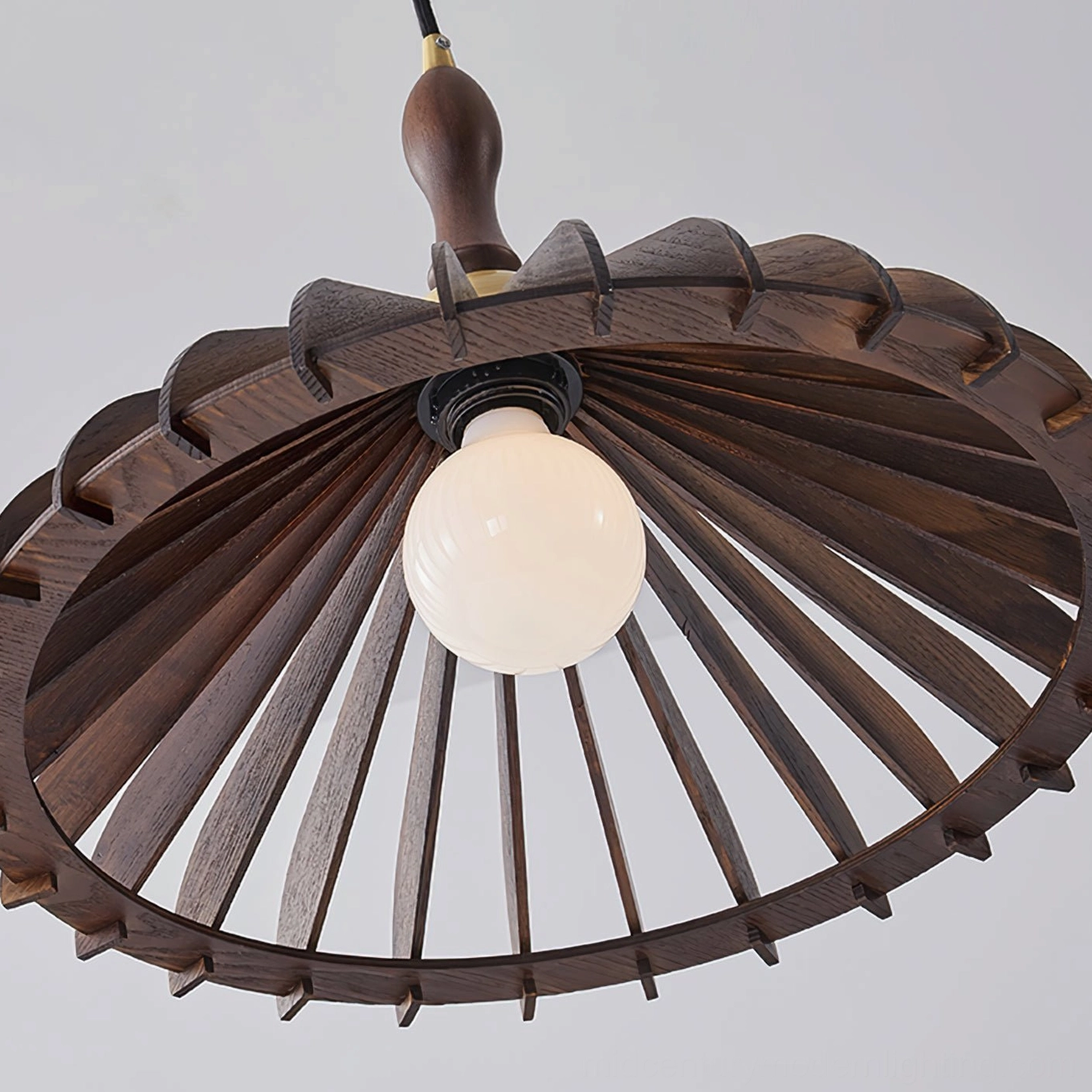 Wooden umbrella pendant shade showing internal slatted construction and warm ambient lighting effect
