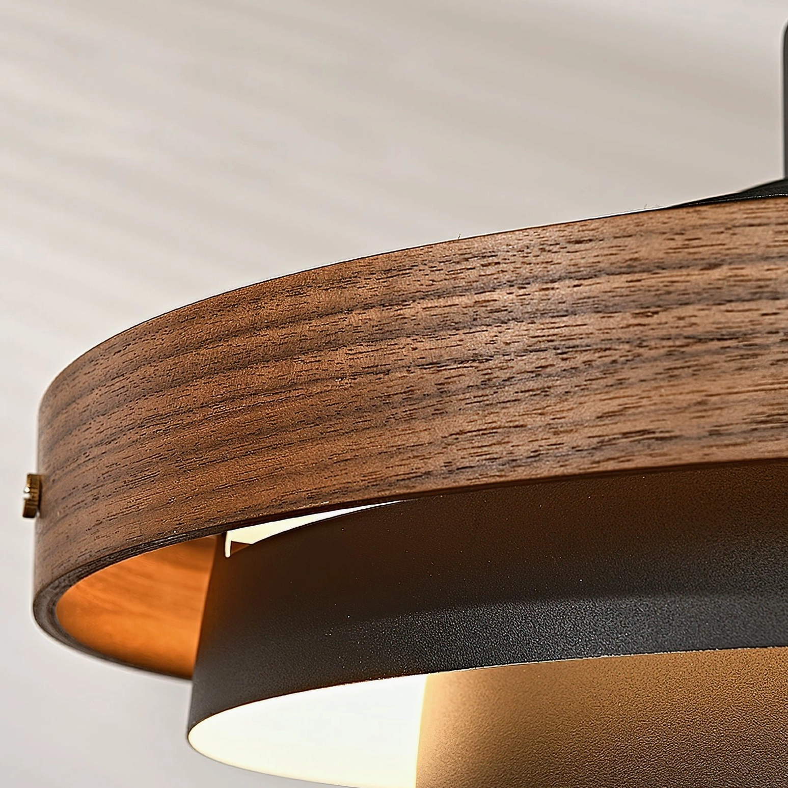 Wood color and white swing arm pendant light in contemporary kitchen space