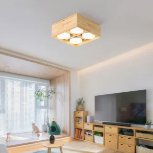 Wooden flush mount square ceiling light installed in japandi style living room above TV console, warm ambient lighting