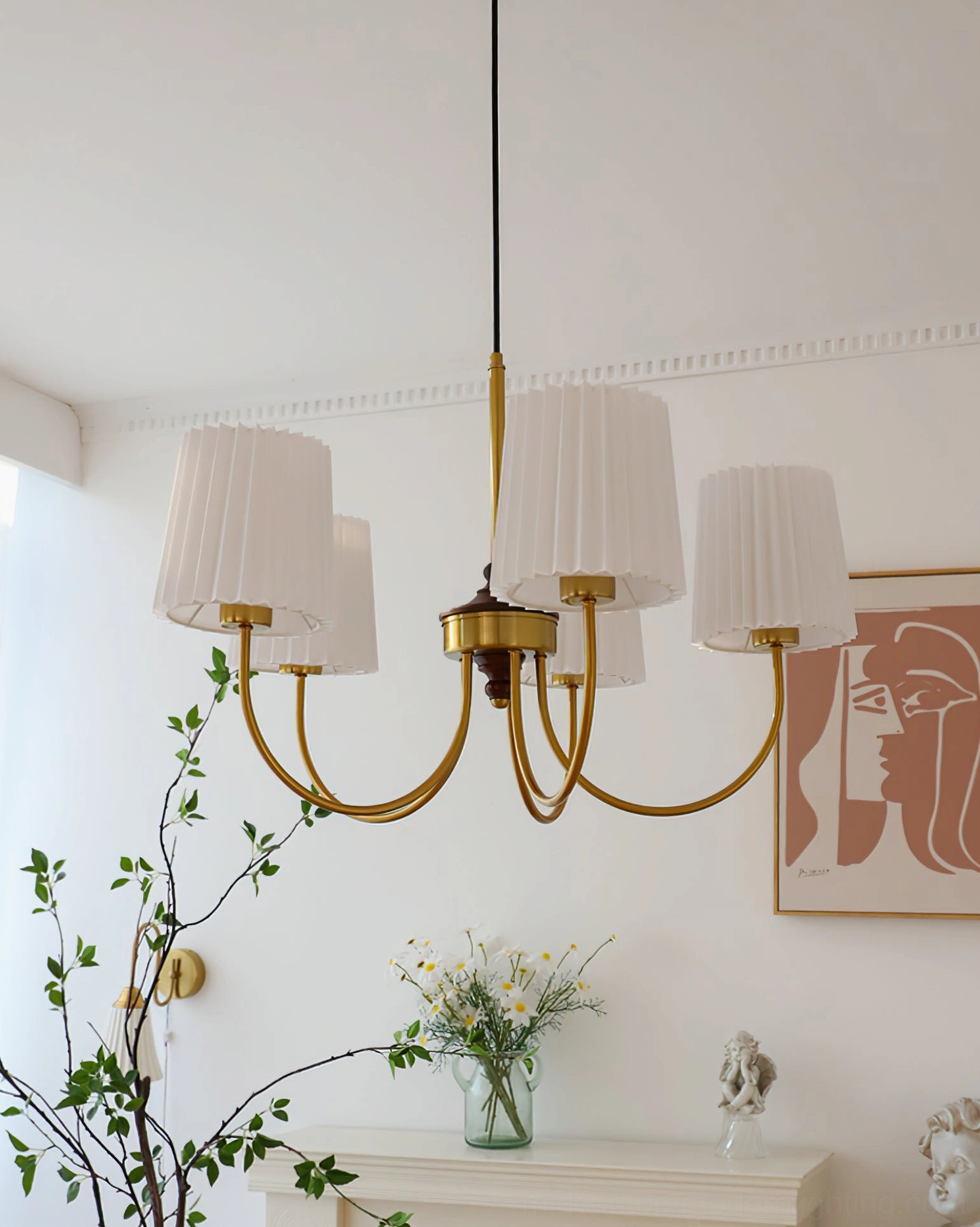 Solid wood chandelier low-angle view in vintage living room with wall art