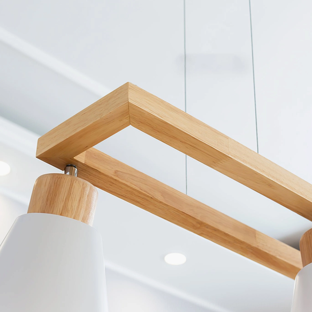 Close-up detail of wooden cone shade and metal hardware on mid-century pendant light fixture