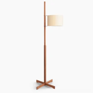 Scandinavian wooden cross-base floor lamp with beige fabric shade, front studio view