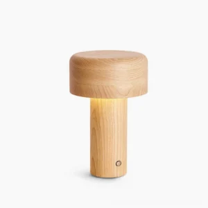Ash wood mushroom table lamp with cylindrical shape and natural wood grain finish on white studio background