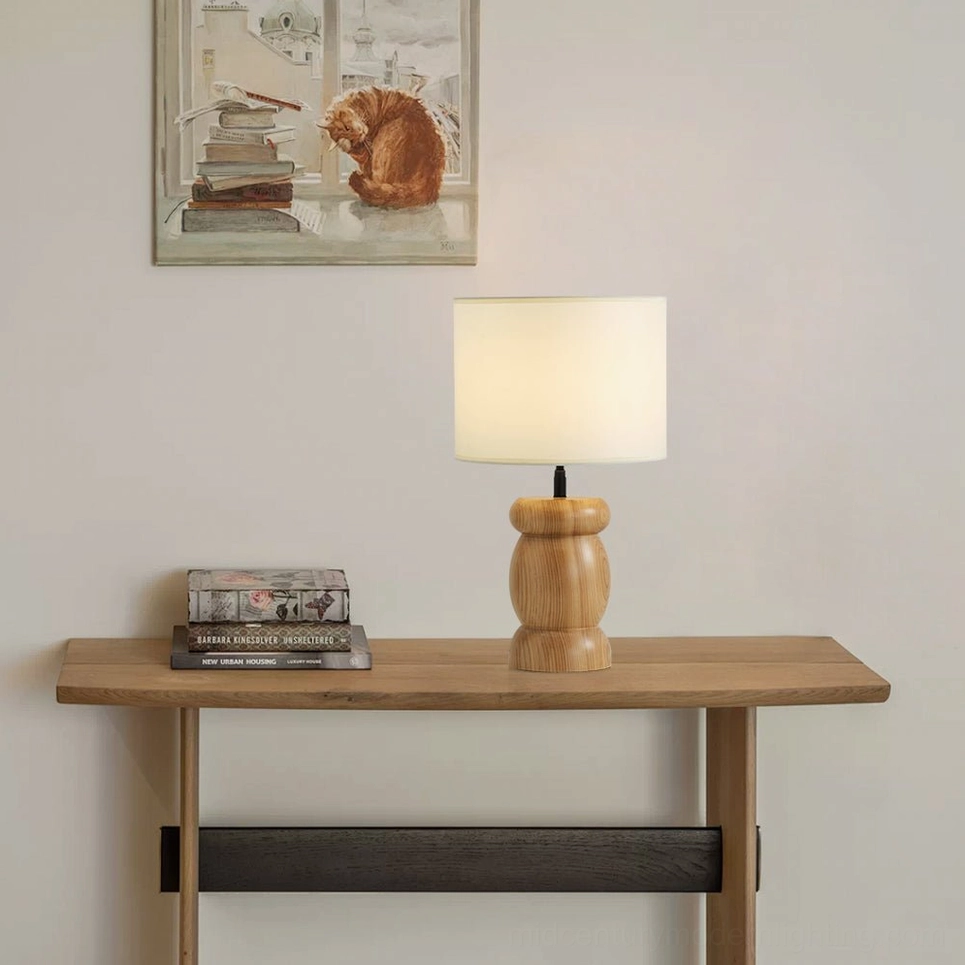 Wooden table lamp with warm-toned fabric diffuser, soft illumination, mid-century modern home décor styling