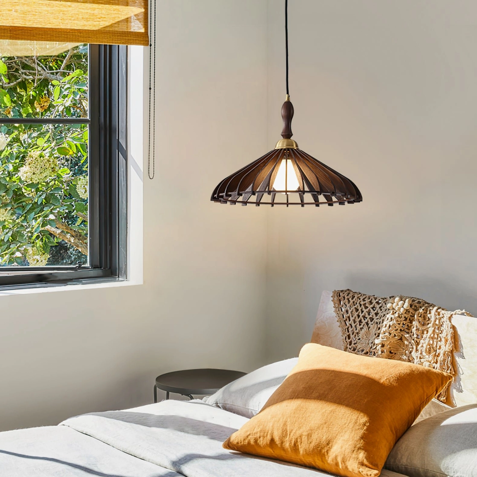 Dark walnut wooden pendant lamp in bedroom bedside setting, japandi minimalist interior design with warm lighting