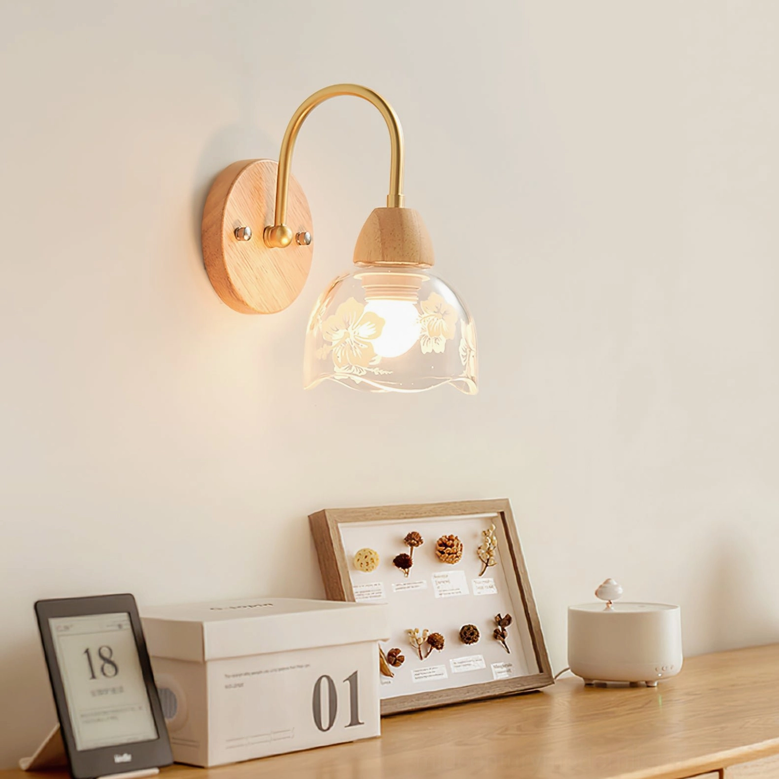Modern wooden wall lamp mounted above desk with decorative frame, Japandi interior style