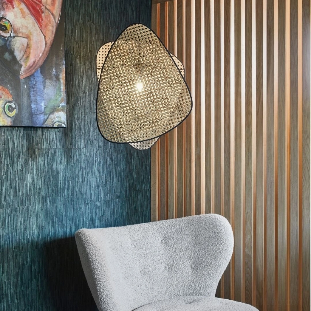 Woven rattan cannage wall lamp natural finish showing sustainable bamboo material and craftmanship