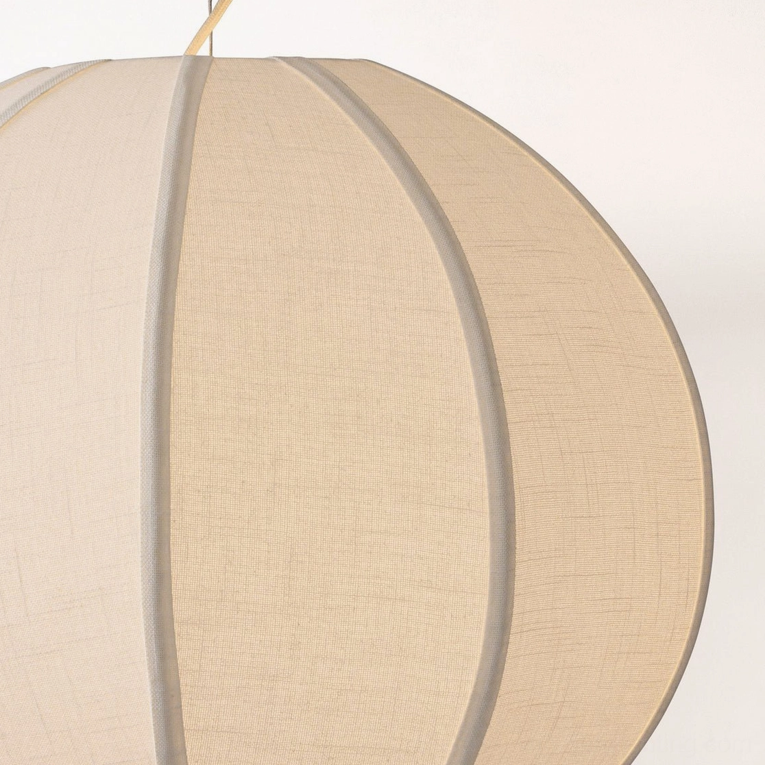Extreme close-up of Yaratam pendant shade showing fine linen weave and panel framing detail