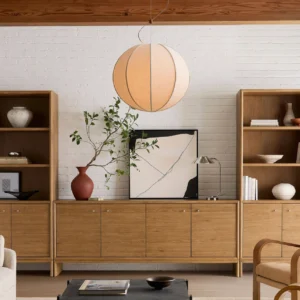 Warm beige Yaratam pendant lamp illuminated in Japandi-style living room with minimalist aesthetic