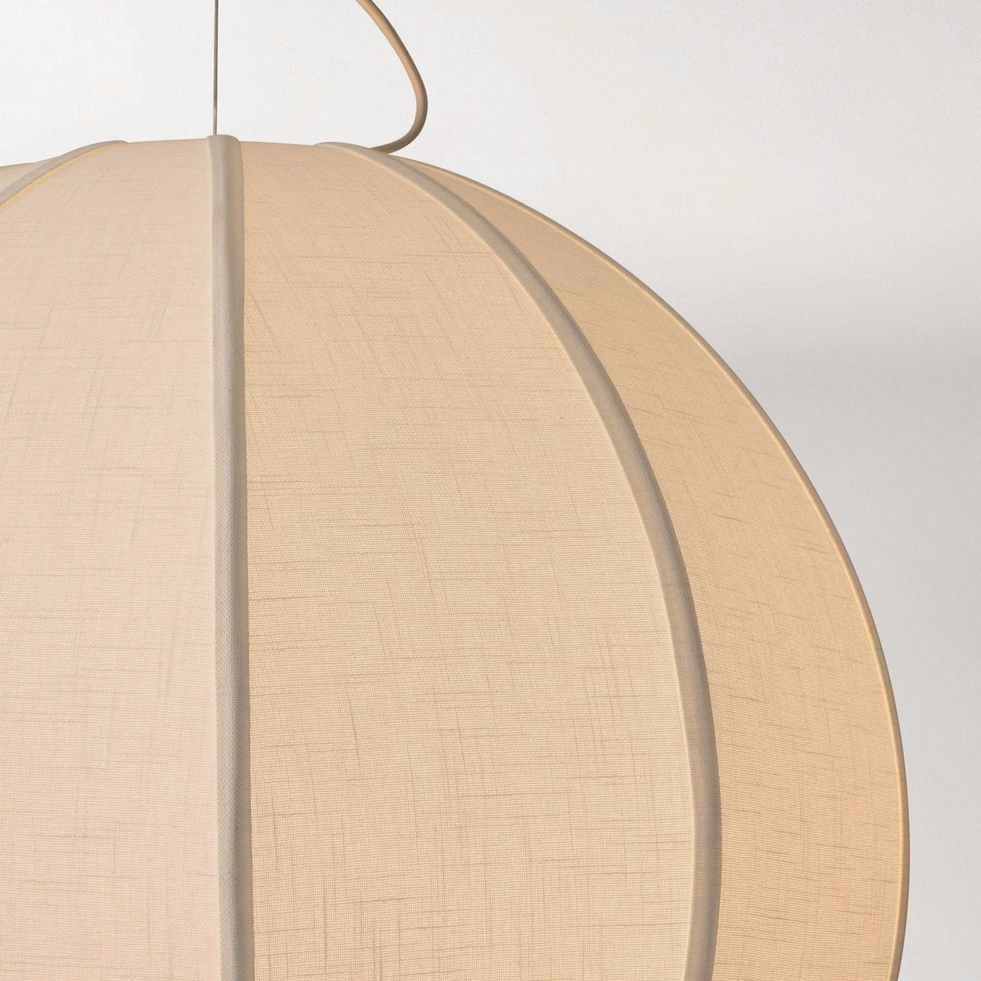 Close-up detail of woven linen texture and panel seams on Yaratam pendant shade