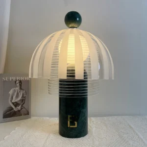 Lit Yasuke table lamp on bedroom dresser with warm ambient glow illuminating frosted glass shade