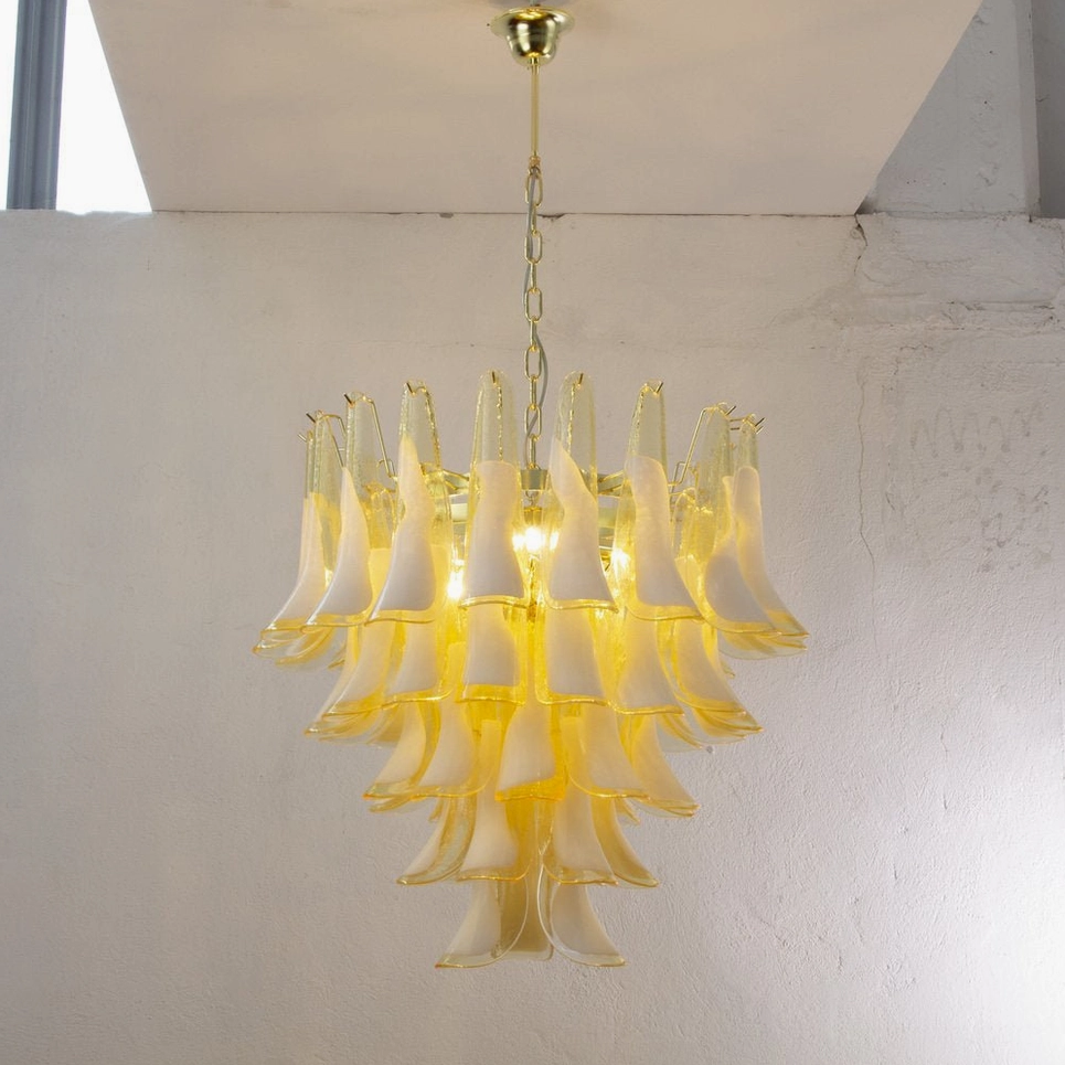 Yellow Petal Rain Murano Glass Chandelier illuminated, warm amber glow, gold hardware