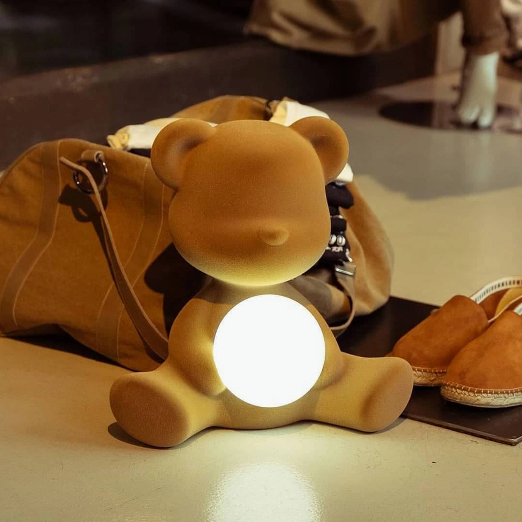 Yellow teddy bear table lamp styled in contemporary home decor setting